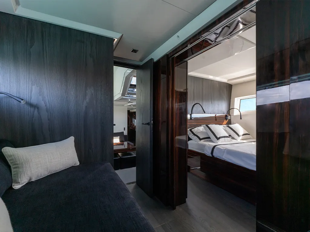 An elegant steel and oak staircase connects the outdoor spaces to a large living area.